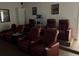 Home theater with many reclining chairs and projector at 2553 Dharma Cir, Kissimmee, FL 34746