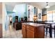 Kitchen boasts white cabinets, a center island, and black appliances at 2553 Dharma Cir, Kissimmee, FL 34746