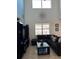 Bright living room features high ceilings, neutral color scheme, and modern decor at 2553 Dharma Cir, Kissimmee, FL 34746