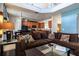 Open-concept living room with a view to the kitchen and second floor at 2553 Dharma Cir, Kissimmee, FL 34746