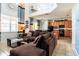 Open concept living room with a view to the kitchen and a breakfast nook at 2553 Dharma Cir, Kissimmee, FL 34746