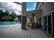 Relaxing poolside patio furniture near the community pool at 2553 Dharma Cir, Kissimmee, FL 34746