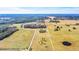 Aerial view of property showing home, pond and large acreage at 26225 Pitts Rd, Eustis, FL 32736