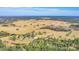 Aerial view of expansive property with large pasture and trees at 26225 Pitts Rd, Eustis, FL 32736