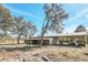 Barn with stalls and covered area for equipment at 26225 Pitts Rd, Eustis, FL 32736