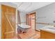 Bathroom featuring a clawfoot tub and wood-paneled walls at 26225 Pitts Rd, Eustis, FL 32736