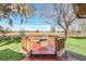 Octagonal deck with stone fire pit and rural view at 26225 Pitts Rd, Eustis, FL 32736