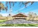 Wooden Gazebo in backyard with basketball hoop at 26225 Pitts Rd, Eustis, FL 32736