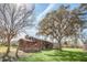 Rustic house exterior with a deck and large trees at 26225 Pitts Rd, Eustis, FL 32736
