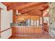 Kitchen boasts wood cabinets, granite counters, and tile floors at 26225 Pitts Rd, Eustis, FL 32736
