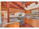 Kitchen with wood cabinets, granite counters, and a view at 26225 Pitts Rd, Eustis, FL 32736