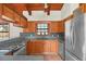Kitchen features wood cabinets, granite counters, and appliances at 26225 Pitts Rd, Eustis, FL 32736