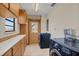 Laundry room with washer, dryer, cabinets and exterior access at 26225 Pitts Rd, Eustis, FL 32736