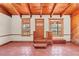Spacious living room with wood-beamed ceilings and tile floors at 26225 Pitts Rd, Eustis, FL 32736