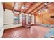 Living room featuring wood-beamed ceilings and tile floors at 26225 Pitts Rd, Eustis, FL 32736