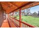 Long wooden porch overlooking a grassy field at 26225 Pitts Rd, Eustis, FL 32736