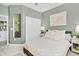 Bedroom with a full-size bed, a mirrored closet, and a neutral color scheme at 275 Sunfish Dr, Winter Haven, FL 33881