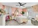 Charming bedroom with pink walls, a canopy bed, and ample closet space at 275 Sunfish Dr, Winter Haven, FL 33881