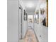 Clean hallway with carpet runner and artwork at 275 Sunfish Dr, Winter Haven, FL 33881