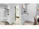 Hallway with a view of a bedroom and bathroom, plus an exterior door at 275 Sunfish Dr, Winter Haven, FL 33881