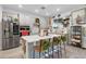 Modern kitchen with white cabinets, quartz countertops, and stainless steel appliances at 275 Sunfish Dr, Winter Haven, FL 33881