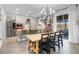 Spacious kitchen with island, stainless steel appliances, and large dining table at 275 Sunfish Dr, Winter Haven, FL 33881
