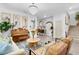 Living room with a piano, chandelier, and view into entryway at 275 Sunfish Dr, Winter Haven, FL 33881