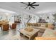 Open concept living room with comfortable seating and views into kitchen and dining area at 275 Sunfish Dr, Winter Haven, FL 33881