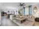 Open living space with a large sectional sofa and a view of the kitchen at 275 Sunfish Dr, Winter Haven, FL 33881