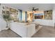 Bright living room with sectional sofa, built-in shelving, and large TV at 275 Sunfish Dr, Winter Haven, FL 33881