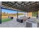 Covered patio with seating area, fire pit, and artificial turf at 275 Sunfish Dr, Winter Haven, FL 33881