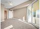 Spacious bedroom with carpeting, ceiling fan and private balcony at 2801 S Ridgewood Ave # 807, South Daytona, FL 32119