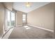 Spacious bedroom with carpeting, ceiling fan, and access to balcony at 2801 S Ridgewood Ave # 807, South Daytona, FL 32119