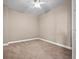Condo bedroom with carpeted floor and ceiling fan at 2801 S Ridgewood Ave # 807, South Daytona, FL 32119