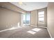 Bright bedroom with balcony access and neutral carpeting at 2801 S Ridgewood Ave # 807, South Daytona, FL 32119
