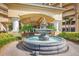 Elegant fountain at the entrance of a residential building, surrounded by landscaping at 2801 S Ridgewood Ave # 807, South Daytona, FL 32119