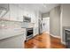 Bright kitchen featuring white cabinets, granite countertops, and stainless steel appliances at 2801 S Ridgewood Ave # 807, South Daytona, FL 32119