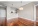 Condo living room with hardwood floors and kitchen bar at 2801 S Ridgewood Ave # 807, South Daytona, FL 32119