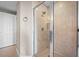 Clean shower with glass enclosure and neutral tile at 2801 S Ridgewood Ave # 807, South Daytona, FL 32119