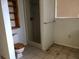 Bathroom with shower, toilet, and built-in shelving at 34847 Learn Rd, Leesburg, FL 34788