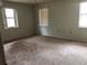 Spacious bedroom with large windows and carpeted floors at 34847 Learn Rd, Leesburg, FL 34788