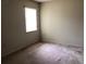 Bright bedroom featuring carpeted floors and a window at 34847 Learn Rd, Leesburg, FL 34788