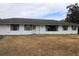 Front view of a ranch home with a spacious yard at 34847 Learn Rd, Leesburg, FL 34788
