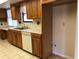 Kitchen with wood cabinets, sink, and built in appliances at 34847 Learn Rd, Leesburg, FL 34788