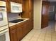 View of kitchen with wood cabinets and a microwave at 34847 Learn Rd, Leesburg, FL 34788