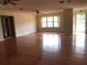 Hardwood floors and large windows in living room at 34847 Learn Rd, Leesburg, FL 34788