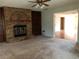 Living room with brick fireplace and built-in shelves at 34847 Learn Rd, Leesburg, FL 34788