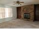 Living room with brick fireplace and built-in shelves at 34847 Learn Rd, Leesburg, FL 34788