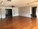 Bright living room with hardwood floors and French doors at 34847 Learn Rd, Leesburg, FL 34788