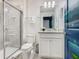 Clean bathroom with granite vanity and a large shower at 3798 Lana Ave, Davenport, FL 33897